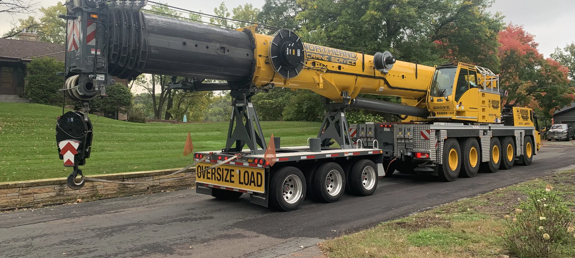 Large crane set up for a tree removal job